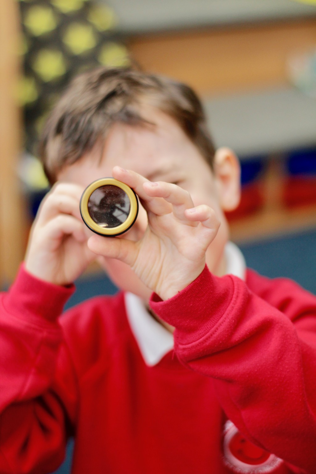 Boy looking through telescope